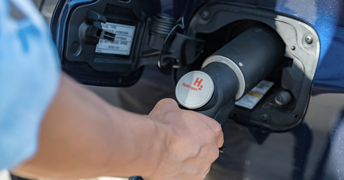Refueling the car with hydrogen at a hydrogen fuel station