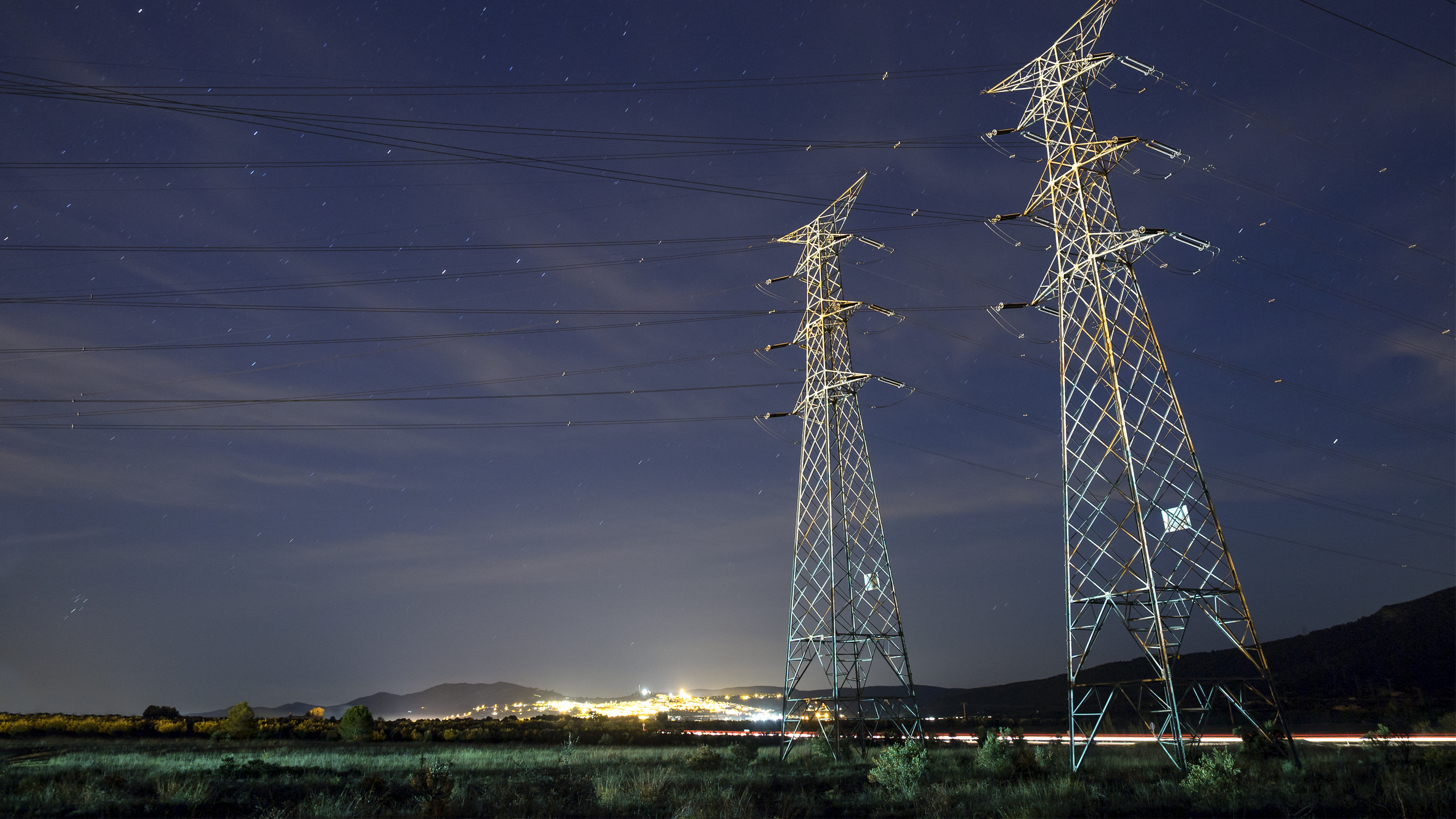 electricity pylons in the night